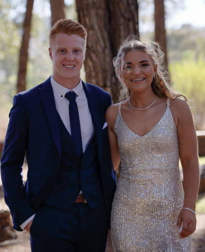 happy couple between trees